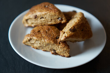 Traditional fresh baked English homemade scones with raisins for breakfast. 