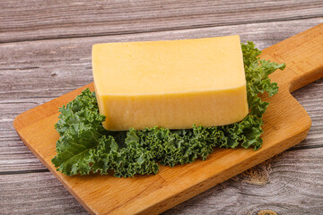 Tasty yelloow Tilsiter cheese brick