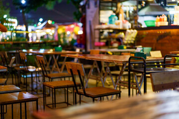 Soft focus background image of bar atmosphere and night light bokeh.