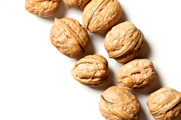 Walnuts on a white background top view. Free space for text. Soft focus. Stylish food background with nuts.