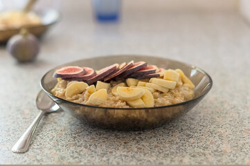 Oatmeal porridge in bowl for breakfast. Delicious nutritious and healthy food