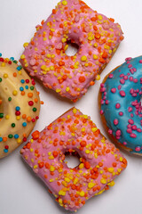 Colored donuts, on a white background.
