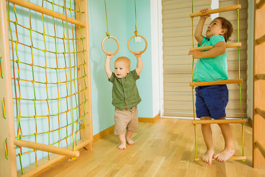 Happy Children Playing At Home Sport Gym