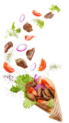 Doner kebab or shawarma with ingredients floating in the air : beef meat, lettuce, onion, tomatos,...