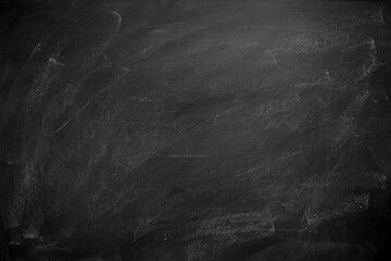 Abstract texture of chalk rubbed out on blackboard or chalkboard background. School education, dark wall backdrop or learning concept.