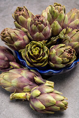 Fresh french petit violet artichokes heads cultivted in Brittany, France