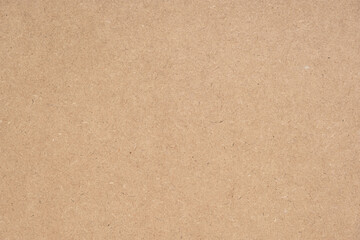 Texture of brown craft or kraft paper background, cardboard sheet, recycle paper, copy space for text.