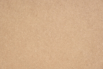 Texture of brown craft or kraft paper background, cardboard sheet, recycle paper, copy space for...
