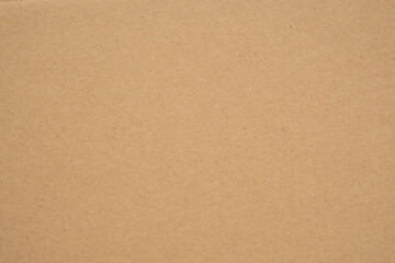 Texture of brown craft or kraft paper background, cardboard sheet, recycle paper, copy space for text.