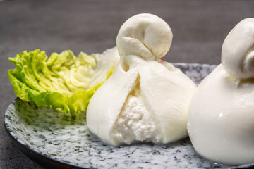 Cheese collection, italian soft white balls of burrata cheese made from mozzarella with cream inside in region Apulia