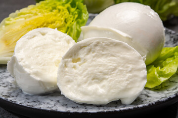 Сheese collection, balls on soft white mozzarella bufala cheese served with green cos lettuce