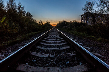 the railway goes into a beautiful sunset