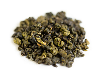 Green tea, on a white background, tea scattered on a white background.