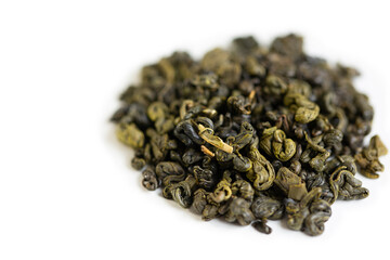Green tea, on a white background, tea scattered on a white background.