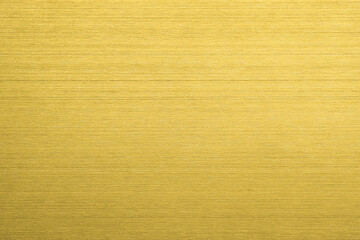 Gold metal texture of brushed stainless steel plate with the reflection of light.
