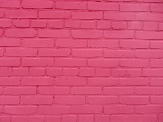 Brick wall texture, pink background with copy space