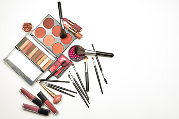 Feminine beauty kit on white. Collection of various makeup accessories. Professional makeup brushes and tools, make-up products set