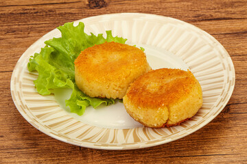 Vegan cuisine - Potato cutlet in the plate