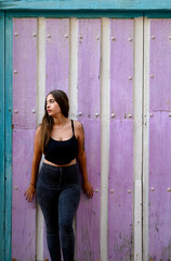 Fototapeta premium portrait of a woman vertical near the colorful background