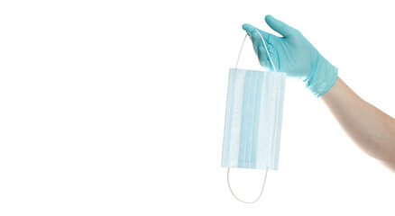 close up of doctor's hand in blue gloves with a medical face mask for protection against infection on white background. Covid. Coronavirus
