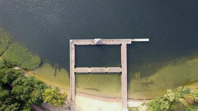 4K footage of pier in Narie lake in Kretowiny village in Ilawa Lake District, Warmia Mazury region of Poland