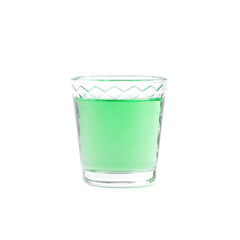 Green liquor in a shot glass isolated on white