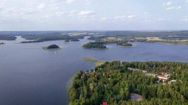 4K drone footage of Narie lake in Kretowiny village, Ilawa Lake District, in Warmia Mazury region of Poland
