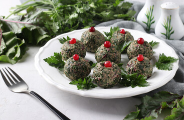 Traditional Georgian appetizer pkhali from beet tops on light gray background, Closeup. Horizontal format