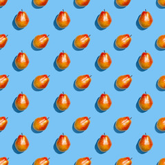 Pears pattern. Colorful seamless pattern of fresh pears on a blue background. Fresh ripe organic pears isolated on a blue surface. Vegan, vegetarian healthy food. Diet organic product.
