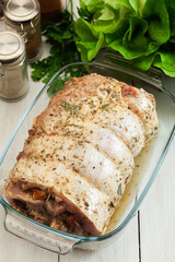 Marinated raw pork roll ready to roast