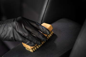 car datailing interior -  dark background,  work passionate about precision