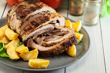 Roasted pork roll stuffed with other meat