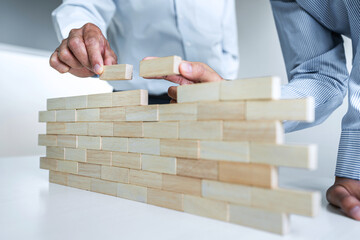 Plan and strategy in business, Risk To Make Business Growth Concept With Wooden Blocks, hand of man...