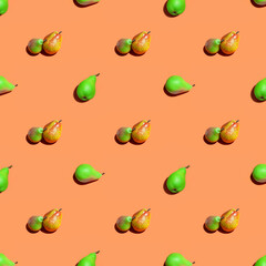 Pears. Fruit seamless pattern of fresh pears on an orange background. Fresh ripe organic pears isolated on orange surface. Vegan, vegetarian healthy food.