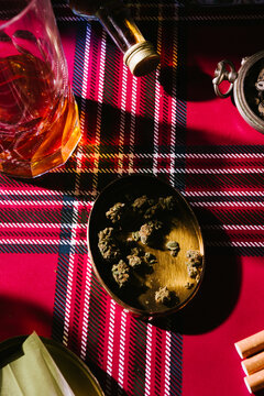 Alcohol drink whiskey poker card on a vice series, long tall glass with whiskey and poker card, on a scottish background