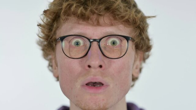 Close up of Face of Shocked Redhead Young Man