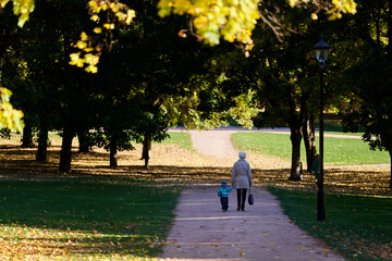 Grandmother and grandson in a public park. 