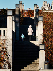 Grandmother and grandson in a public park. 
