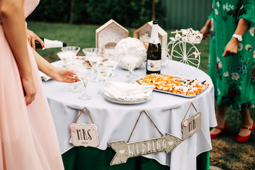 Wedding white reception place ready for guests. Elegant banquet tables prepared for a party.
