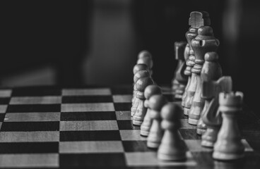 Wooden chess on the chessboard. Selective focus.