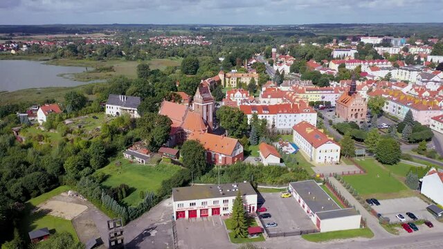 4k drone footage of old town of Morag town, Poland view with St Joseph Church anf Town hall
