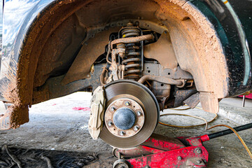 Closeup of car disc brake at Garage.