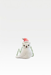 merry cristmas white owl with santa hat on a white background
