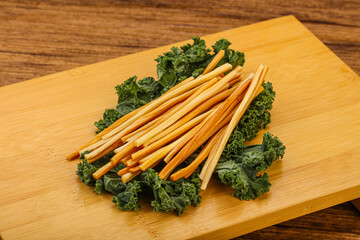 Chechel cheese sticks over board