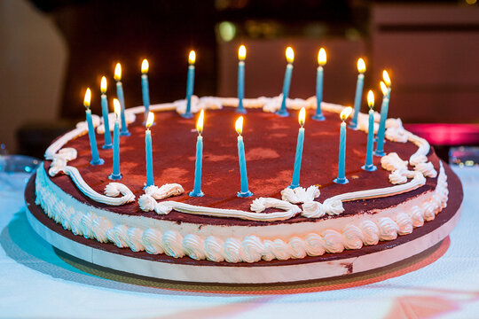 Eighteen years birthday. Chocolate Cake with burning candle
