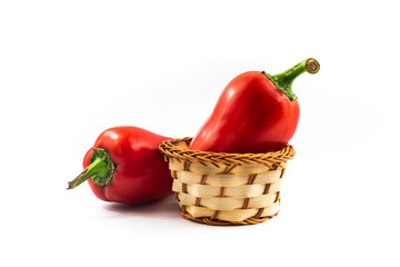 Red peppers in a basket, harvesting, photo for menu, on white isolated background