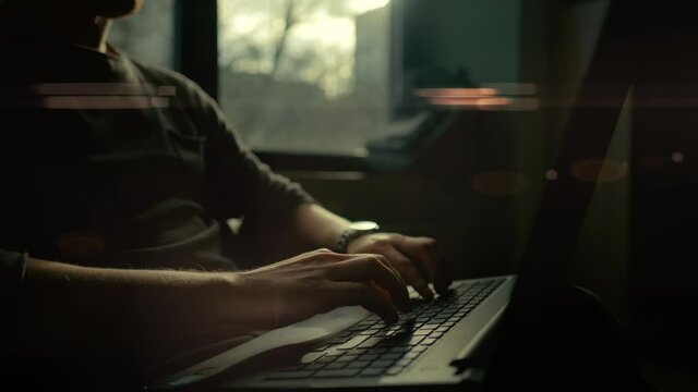 A programmer is typing new lines of HTML code. Laptop closeup. Working time. Web design business concept.