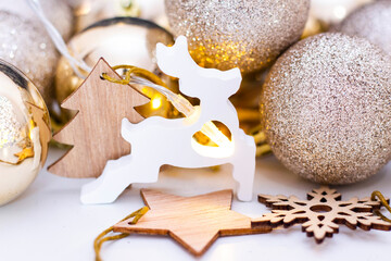 Christmas composition with decorations. Merry Christmas. Deer with a light bulb