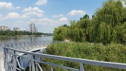 Fototapeta premium lake, water, nature, landscape, sky, reflection, forest, blue, pond, pier, tree, autumn, summer, calm, trees, green, clouds, wood, wooden, scenery, outdoors, cloud, tranquil, spring, grass