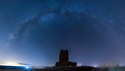 Milky way over a castle